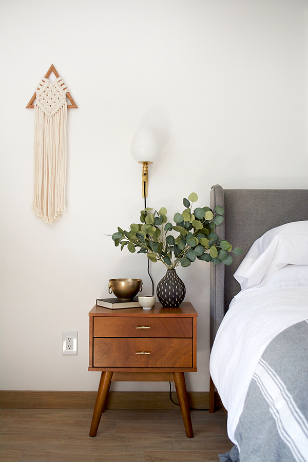 Brass Sconce Above Night Stand 